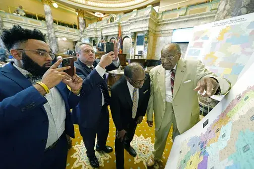 Mississippi state Sens. Rod Hickman, D-Macon, left, Michael McLendon, R-Hernando, second from left, Albert Butler, D-Port Gibson, and David Jordan, D-Greenwood, review an alternate Senate redistricting map at the Mississippi Capitol in Jackson, Miss., March 29, 2022. Three federal judges ruled Tuesday, July 2, 2024, that Mississippi legislators must redraw some state House and Senate districts because the districts adopted in 2022 dilute Black voting power. (AP Photo/Rogelio V. Solis, File)