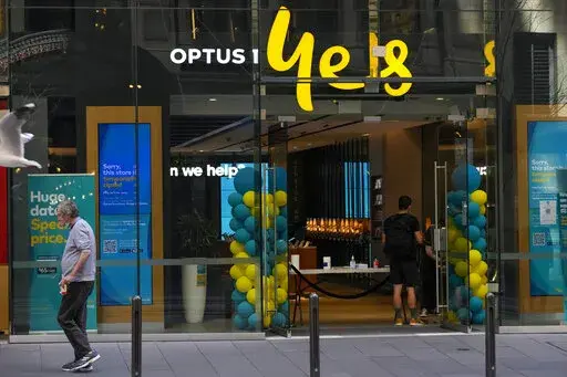 A customer waits for service at a Optus phone store in Sydney, Australia, Thursday, Oct. 7, 2021. The Australian government said on Monday, Sept. 26, 2022, it was considering tougher cybersecurity rules for telecommunications companies after Optus, the nation’s second-largest wireless carrier, reported personal data of 9.8 million customers had been breached. (AP Photo/Mark Baker, File)