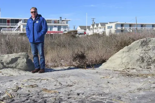 Mayor Patrick Rosenello stands next to a destroyed section of sand dune in North Wildwood N.J. on Jan. 22, 2024. (AP Photo/Wayne Parry, FILE)