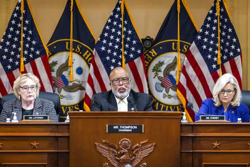 Chairman Bennie Thompson, D-Miss., center, speaks as the House select committee investigating the Jan. 6 attack on the U.S. Capitol holds its final meeting on Capitol Hill in Washington, Dec. 19, 2022. From left, Rep. Zoe Lofgren, D-Calif., Thompson and Vice Chair Liz Cheney, R-Wyo. A report set to be released by House investigators will conclude that then-President Donald Trump criminally plotted to overturn his 2020 election defeat and “provoked his supporters to violence” at the Capitol w