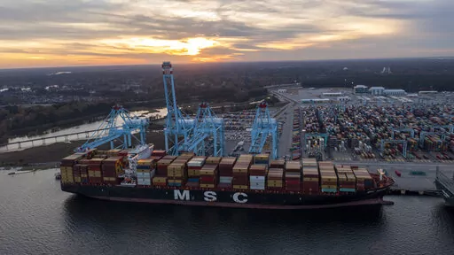 The sun sets behind The Mediterranean Shipping Company ship MSC Meline, front, which is in the process of being loaded at the Virginia International Gateway Marine terminal Wednesday Dec 1, 2021, in Norfolk, Va. For many, supply chain issues mean that you didn’t get your kid the exact toy they wanted or that your favorite spice isn’t in stock at the grocery store. On the surface, some might think the hotel industry is immune to supply chain concerns.  (AP Photo/Steve Helber, File)