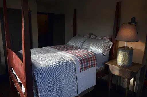 A shaft of light shines into a bedroom in Belle, W.Va., on Nov. 11, 2013. (Craig Cunningham/The Daily Mail via AP, File)