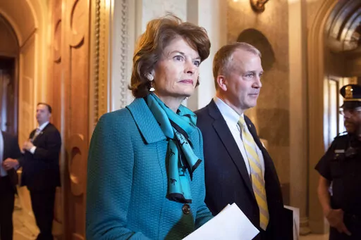 Sen. Lisa Murkowski, R-Alaska, left, and Sen. Dan Sullivan, R-Alaska, leave the chamber after a vote on Capitol Hill in Washington on May 10, 2017. Two Russians who said they fled the country to avoid compulsory military service have requested asylum in the U.S. after landing on a remote Alaskan island in the Bering Sea, Alaska U.S. Sen. Lisa Murkowski's office said Thursday, Oct. 6, 2022. (AP Photo/J. Scott Applewhite, File)