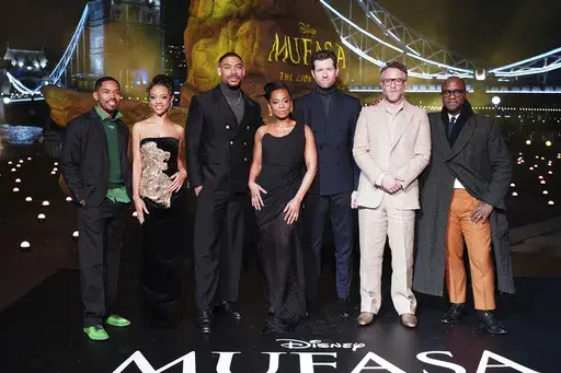 From left to right Kelvin Harrison Jr., Tiffany Boone, Aaron Pierre, Anika Noni Rose, Billy Eichner, Seth Rogan and Barry Jenkins attend a photo call for Mufasa: The Lion King at Potters Field, in London, Wednesday, Dec. 11, 2024. (Ian West/PA via AP)