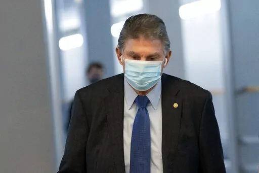 Sen. Joe Manchin, D-W.Va., walks to a vote in the Senate Chamber, Dec. 15, 2021, in Washington. (AP Photo/Jacquelyn Martin, File)