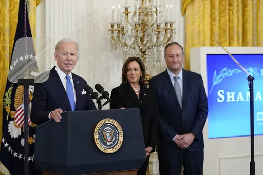 President Joe Biden speaks during a reception to celebrate the Jewish new year in the East Room of the White House in Washington, Friday, Sept. 30, 2022. Vice President Kamala Harris and her husband Doug Emhoff look on at right. Biden on Thursday, May 25, 2023, announced what he said is the most ambitious and comprehensive undertaking by the U.S. government to fight hate, bias and violence against Jews, outlining more than 100 steps the administration and its partners can take to combat an alarm