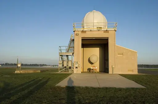 A National Weather Service weather balloon sits ready for launch in the Upper Air Inflation Building at the National Weather Service, April 27, 2006, in Sterling, Va. (AP Photo/Chris Greenberg, File)