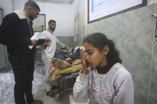 Palestinians wounded in Israeli bombardment receive treatment in a hospital t in Rafah, Gaza Strip, Monday, Feb. 5, 2024. (AP Photo/Hatem Ali)