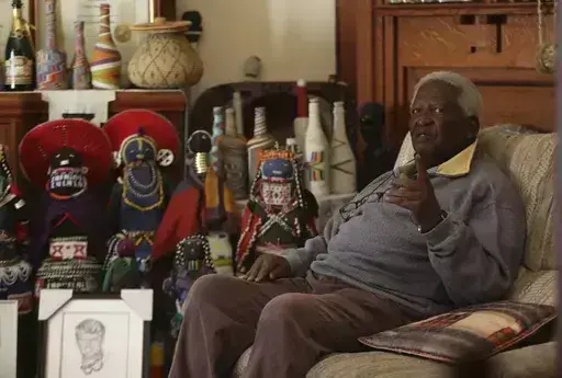 South African photographer Peter Magubane, speaks with The Associated Press during an interview at his home, in Johannesburg, Thursday June 2, 2016. Magubane, a fearless photographer who captured the violence and horror of South Africa’s brutal apartheid era of racial oppression and was then entrusted with documenting Nelson Mandela’s first years of freedom after his release from prison, has died. He was 91. The South African National Editors’ Forum said it had been informed by Magubane's 