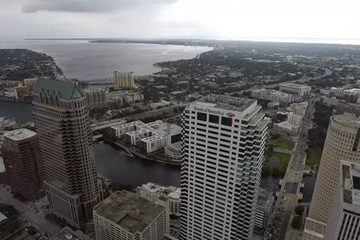 In this aerial image, the city of Tampa, Fla., is seen Monday, Sept. 26, 2022. Hurricane Ian was growing stronger as it barreled toward Cuba on a track to hit Florida's west coast as a major hurricane as early as Wednesday. It's been more than a century since a major storm like Ian has struck the Tampa Bay area, which blossomed from a few hundred thousand people in 1921 to more than 3 million today. (DroneBase via AP)