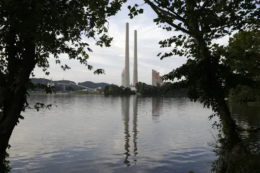 In this Aug. 7, 2019, photo, the Kingston Fossil Plant stands near a waterway in Kingston, Tenn. The nation’s largest public utility is moving ahead with a plan for a new natural gas plant in Tennessee despite warnings that its environmental review of the project doesn’t comply with federal law. The Environmental Protection Agency asked the Tennessee Valley Authority in a March 25, 2024 letter to redo several aspects of its environmental impact statement for converting the coal-burning Kings