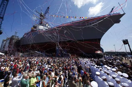 An Arleigh-Burke Class destroyer is christened at Bath Iron Works in Bath, Maine, Aug. 1, 2009. The U.S. Navy's workhorse destroyer went into production more than 30 years but will soon be replaced by a new destroyer that will feature lasers that can shoot down missiles and attack enemies with hypersonic missiles topping 3,800 mph. (AP Photo/Robert F. Bukaty, File)