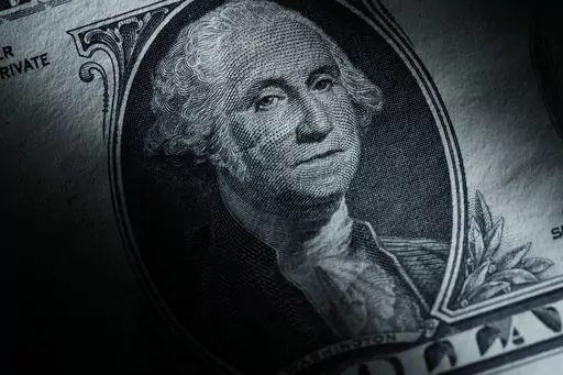 The likeness of George Washington is seen on a U.S. one dollar bill, Monday, March 13, 2023, in Marple Township, Pa. After years of paying low rates for savers, banks are finally offering better interest on deposits. Moving your savings around by opening a new account and closing an old one can seem like a hassle, but it's a use of time that can pay off. (AP Photo/Matt Slocum)