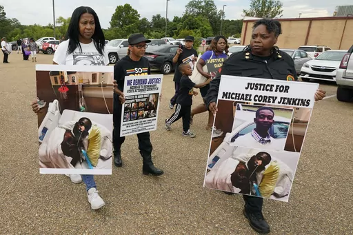 Activists march towards the Rankin County Sheriff's Office in Brandon, Miss., Wednesday, July 5, 2023, calling for the termination and prosecution of Rankin County Sheriff Bryan Bailey for running a law enforcement department that allegedly terrorizes and brutalizes minorities. Six white former law enforcement officers in Mississippi have pleaded guilty to a racist assault on Michael Corey Jenkins and his friend Eddie Terrell Parker, who are Black. (AP Photo/Rogelio V. Solis, File)