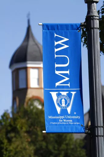  A banner for Mississippi University for Women hangs at the campus in Columbus, Miss., on Oct. 27, 2008. President Nora Miller said in a letter to alumni in the fall semester of 2022 that the university, which has also been enrolling men for 40 years, should consider a new name that is more inclusive. (AP Photo/Rogelio V. Solis, File)