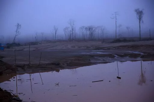 This Wednesday, Feb. 24, 2016 photo shows the deforestation of what was once pristine rainforest, caused by gold mining, during a government raid on illegal wildcat mining operations in La Pampa, in Peru's Madre de Dios region. The Monitoring of the Andean Amazon Project, an initiative of the nonprofit Amazon Conservation Association, reported on Thursday, June 2, 2022, that deforestation in the Peruvian Amazon has hit six historical highs in the past ten years.  (AP Photo/Rodrigo Abd, FIle)
