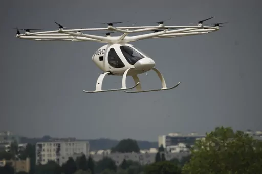 The Volocopter 2X, an electric vertical takeoff and landing multicopter, performs a demonstration flight during the Paris Air Show in Le Bourget, north of Paris, France, Monday, June 19, 2023. (AP Photo/Lewis Joly)
