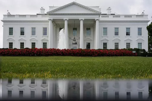 The White House is seen reflected in a puddle, Saturday, Sept. 3, 2022, in Washington. With roughly a year and a half until the 2024 presidential contest, the field of candidates is largely set. Former President Donald Trump and Florida Gov. Ron DeSantis have dominated the early Republican race, but other candidates including former Vice President Mike Pence, former United Nations Ambassador Nikki Haley and U.S. Sen. Tim Scott of South Carolina are looking for an opening in case either falters. 
