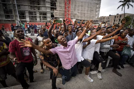 Party agents and supporters of presidential candidate Peter Obi of the Labour Party cheer as their candidate wins the count at a polling station near to the home of ruling party presidential candidate Bola Tinubu, in Lagos, Nigeria Saturday, Feb. 25, 2023. Voters in Africa's most populous nation are heading to the polls Saturday to choose a new president, following the second and final term of incumbent Muhammadu Buhari. (AP Photo/Ben Curtis)