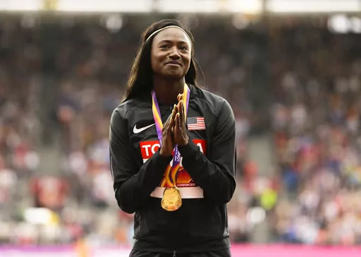United States' Tori Bowie gestures after receiving the gold medal she won in the women's 100m final during the World Athletics Championships in London, Monday, Aug. 7, 2017. U.S. Olympic champion sprinter Tori Bowie died from complications of childbirth, according to an autopsy report. Bowie, who won three medals at the 2016 Rio de Janeiro Games, was found dead last month. She was 32. (AP Photo/Alastair Grant, File)