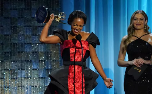 Mishael Morgan accepts the award for outstanding performance by a lead actress in a drama series for her role in "The Young and the Restless" at the 49th annual Daytime Emmy Awards on Friday, June 24, 2022, in Pasadena, Calif. (AP Photo/Chris Pizzello)