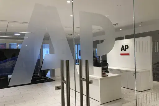 The Associated Press logo is shown at the entrance to the news organization's office in New York on Thursday, July 13, 2023. (AP Photo/Aaron Jackson, File)
