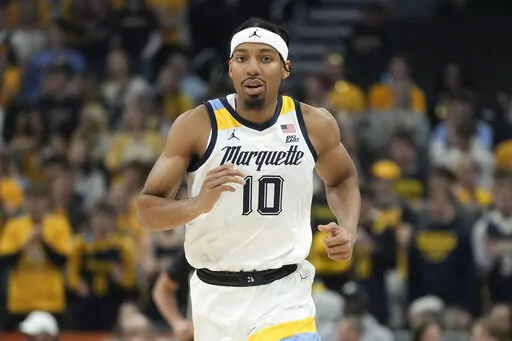 Marquette's Zach Wrightsil runs during the first half of an NCAA college basketball game against Radford Monday, Nov. 7, 2022, in Milwaukee. They already overcame the ravages of a hurricane to win a national title at their old school. Now former Loyola-New Orleans teammates Zach Wrightsil, Myles Burns and Brandon Davis are aiming for one more improbable achievement as they attempt to make the leap from their NAIA program and succeed at the NCAA Division I level. (AP Photo/Morry Gash)
