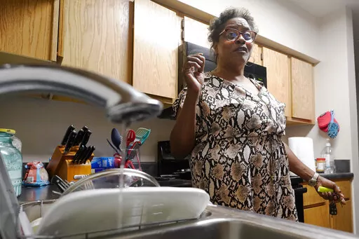 A trickle of water comes out of the faucet at Mary Gaines' Golden Keys Senior Living apartment in Jackson, Miss., Sept. 1, 2022. The federal government will put $600 million toward repairing the troubled water system in Mississippi's capital city...a project that the mayor has said could cost billions of dollars. Funding for Jackson, Miss., water is included in a $1.7 trillion federal spending bill that passed the Senate on Thursday, Dec. 22, and the House on Friday, Dec. 23. President Joe Biden