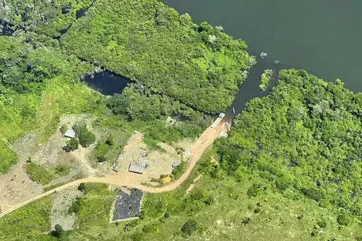 This May 2, 2022, photo provided by Xingu + Network shows an illegal road inside a protected area called Terra do Meio (Middle Earth) Ecological Station in Para state, in the Brazilian Amazon. The dirt road is now just a few miles shy of connecting two of the worst areas of deforestation in the region. (Xingu + Network via AP)