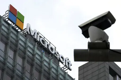 A security surveillance camera is seen near the Microsoft office building in Beijing, July 20, 2021. Microsoft says cyberattacks by state-backed Russian hackers have destroyed data across dozens of organizations in Ukraine and produced a “chaotic information environment.” The company said in a report released Wednesday, April 27, that Russia-aligned threat groups were preparing long before the Feb. 24 invasion. (AP Photo/Andy Wong, File)
