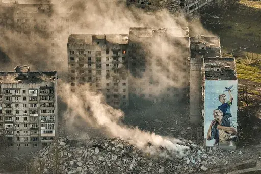 Smoke rises from a building in Bakhmut, site of the heaviest battles with the Russian troops in the Donetsk region, Ukraine, April 26, 2023. The GOP has been softening its stance on Russia ever since Donald Trump won the 2016 presidential election following Russian hacking of his Democratic opponents. The reasons include Russian President Vladimir Putin holding himself out as an international champion of conservative Christian values, the GOP's growing skepticism of international entanglements a