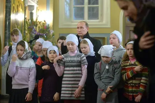 Russian President Vladimir Putin attends a midnight Mass on Russian Orthodox Christmas in the village of Turginovo, about 150 kilometers (90 miles) northwest of Turginovo, Russia on Jan. 7, 2016. As Putin has formed a closer alliance with the Orthodox Church, the country has embraced what officials call “traditional values,” and Russia has sought to put more restrictions on abortion. Russia’s health minister has condemned women for prioritizing careers over childbearing. (Alexei Druzhinin,