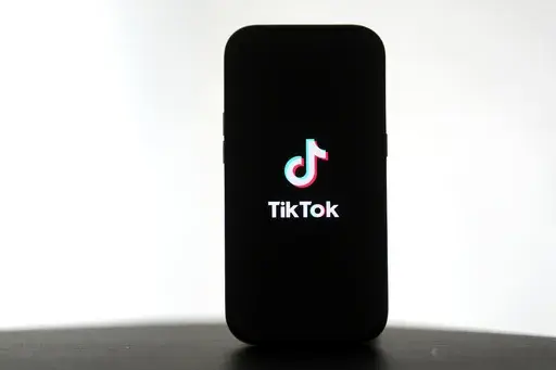 A TikTok logo is shown on a phone in San Francisco, Friday, Jan. 17, 2025. (AP Photo/Jeff Chiu)