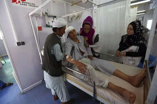 In this Wednesday, May 20, 2015 photo an Afghan boy recovers at a Medecins Sans Frontieres hospital in Kunduz province, north of Kabul, Afghanistan. On Saturday, Dec. 26, 2022, Taliban authorities announced the exclusion of women from NGOs, allegedly because they weren't wearing the headscarf, or hijab, correctly. The move prompted international aid agencies to halt operations in Afghanistan, raising the possibility that millions of people will be left without food, education, health care and ot