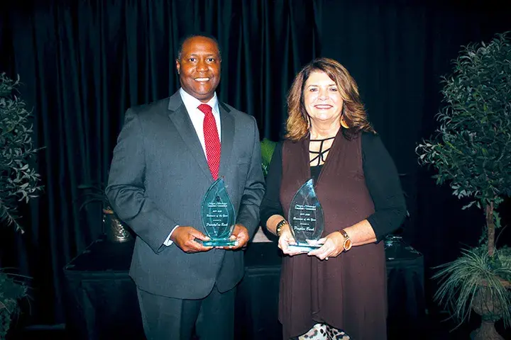 Fountaine McNair, left, represented PriorityOne Bank, and Vicki Dawsey represented Peoples Bank as both banks received Business of the Year honors from the Magee Chamber of Commerce for their continued support of the community.