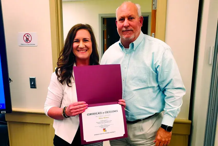 Asso. Supt. Misty  Hanna was recognized by Supt. Greg Paes for earning a State Leadership Award as an NAFEPA board member. 